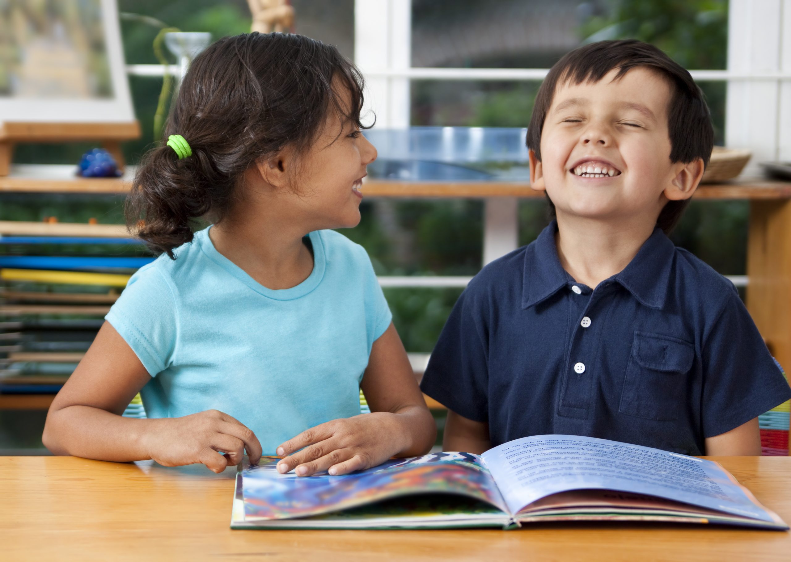 Preschoolers enjoying a book